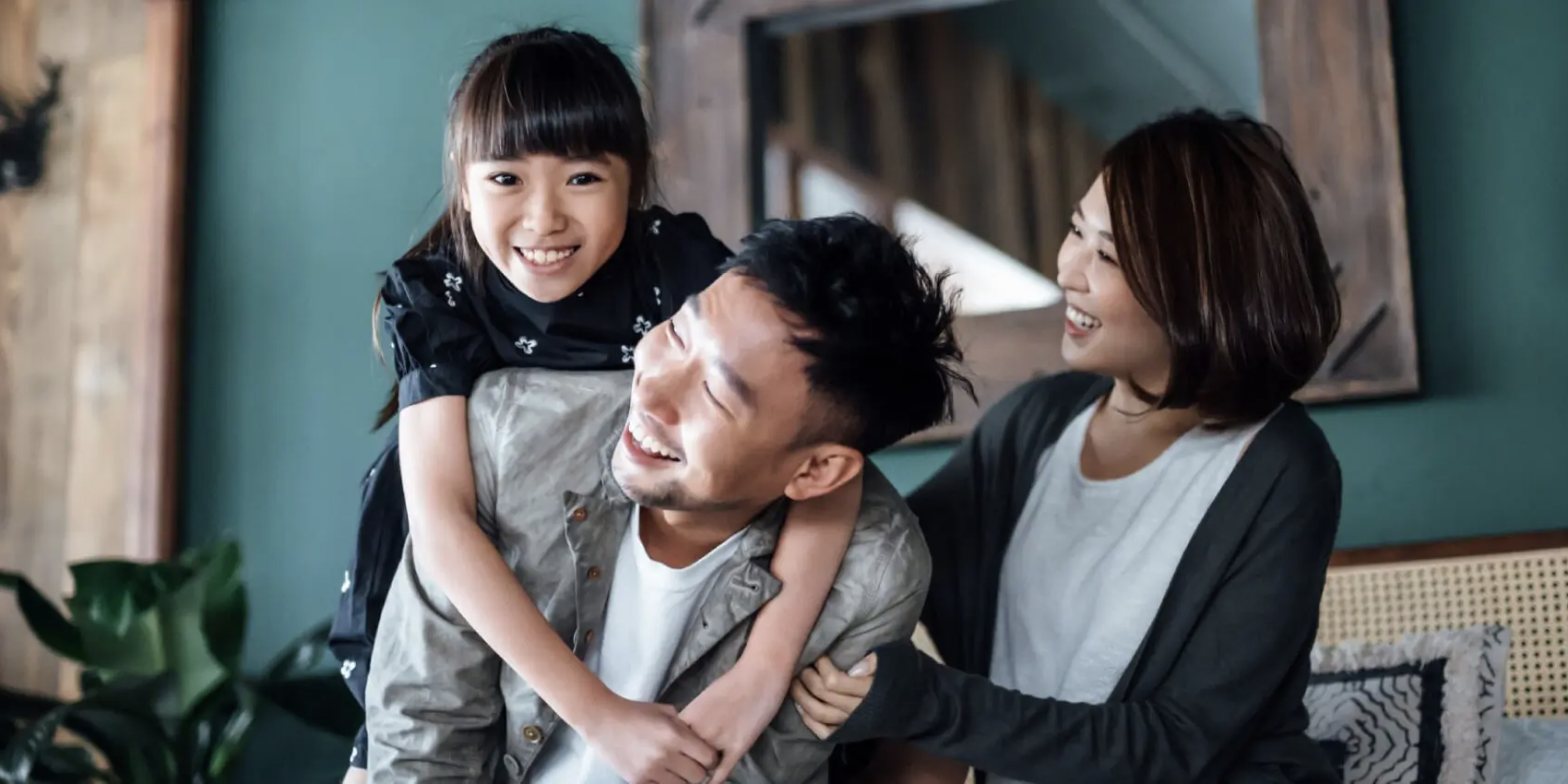 Family laughing together at home